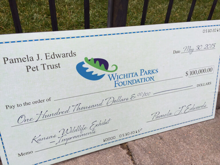 Giant check from the Pamela J Edwards Pet Trust for $100,000.